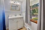 First floor bathroom with tub and shower
